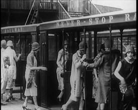 A Group of Female Civilians Board a Carriage of the 'Never Stop Railway', 1924. Creator: British Pathe Ltd.