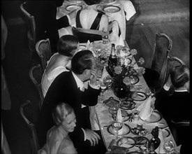 People Eating Dinner, 1930s. Creator: British Pathe Ltd.