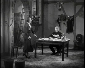 Comedian Robb Wilton On Set Playing a Fire Brigade Officer and Sitting at a Desk With Papers...,1938 Creator: British Pathe Ltd.