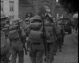 British Soldiers Marching Through a French Town, 1940. Creator: British Pathe Ltd.