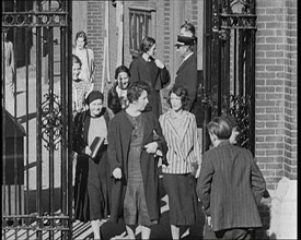 Workers Leaving Factory Through Factory Gates Which Are Closed After Them, 1932. Creator: British Pathe Ltd.