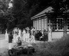 Cricket Players Relaxing Outside, 1940. Creator: British Pathe Ltd.