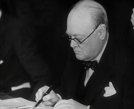 Winston Churchill Signing an Agreement Allowing the USA to use British Naval Bases in..., 1941. Creator: British Pathe Ltd.