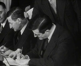 Wendell Willkie Signing an Agreement Allowing the USA to use British Naval Bases..., 1941. Creator: British Pathe Ltd.