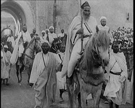 Male Cavalry Soldiers Entering a Town, 1920s. Creator: British Pathe Ltd.