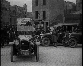 Male Civilian Driving a Car Out of a Parking Space On the Streets of London Watched By..., 1920s. Creator: British Pathe Ltd.