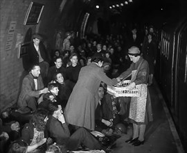 Civilians are Served Refreshments While Sheltering from Bombs in the London Underground, 1940. Creator: British Pathe Ltd.