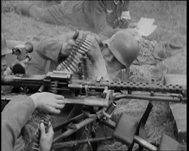 Two German Soldiers Firing a Machine Gun..., 1937. Creator: British Pathe Ltd.