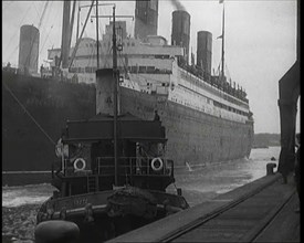 A Tugboat Pulling an Atlantic Liner into a Harbour, 1920s. Creator: British Pathe Ltd.