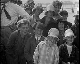 A Group of Male and Female Children Laughing as They Are Watching a Film Being Made, 1920s. Creator: British Pathe Ltd.