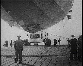 Airship Approaching an Aircraft Carrier And Attempting To Land, 1920s. Creator: British Pathe Ltd.