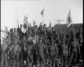 A Group of Male Japanese Soldiers, Many Waving Guns Aloft and Some With Japanese Flags..., 1937. Creator: British Pathe Ltd.