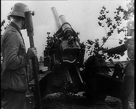 Two Male German Soldiers by an Artillery Gun, 1939. Creator: British Pathe Ltd.