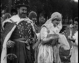 The Actor Henny Porten Dressed in Period Costume Putting on Make up from a Powder Compact..., 1920s. Creator: British Pathe Ltd.