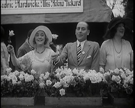 The Actors Helena Pickard and Cedric Hardwicke Holding Roses, 1920s. Creator: British Pathe Ltd.