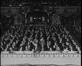 Civilians Seated Waiting For a Play To Begin As the Curtains Open, 1920s. Creator: British Pathe Ltd.