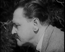 Somerset Maugham Walking Around a Garden, 1920s. Creator: British Pathe Ltd.