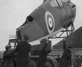 An American Aircraft Part Being Carried by a Crane to Be Sent by the USA to Britain, 1941. Creator: British Pathe Ltd.