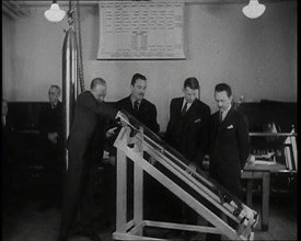 Interior Shot of a British Man Inserting Various Items in a Long Thin Glass Time Capsule..., 1938. Creator: British Pathe Ltd.