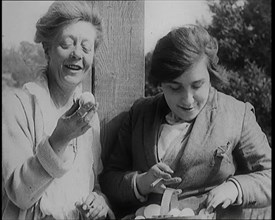 Stage Star Syndey Fairbrother Collecting Hen Eggs on Her Farm, 1920s. Creator: British Pathe Ltd.