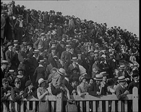 A Group of People Waving As Old Fashioned Looking Hot Air Balloons Are Taking Off the Ground, 1920s. Creator: British Pathe Ltd.