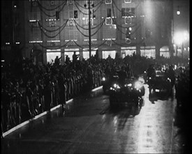 A Nazi Party Motorcade Driving Down a Berlin Street Lined With Crowds..., 1937. Creator: British Pathe Ltd.