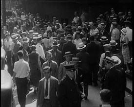 People Walking Around on a Crowded Street, 1930s. Creator: British Pathe Ltd.