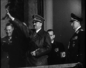 Adolf Hitler, the German Leader, Saluting the Crowd with Hermann Goering and..., 1937. Creator: British Pathe Ltd.