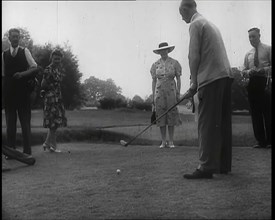 Men and Women at  the Golf Links With One Man Lining up His Shot, 1939. Creator: British Pathe Ltd.