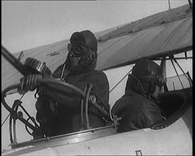 Male British Pilots On Board a Plane And Mounting a Machine Gun, 1920s. Creator: British Pathe Ltd.