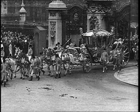 The Royal Coach, Horses, and Procession Filing Out of the Gates at the Front of Buckingham..., 1937. Creator: British Pathe Ltd.