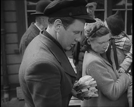 Dutch Refugees Receiving Food at a Reception Centre in the United Kingdom, 1940. Creator: British Pathe Ltd.