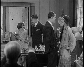 Scene from a 1920s Film. A Group of Actors Playing Bright Young Things Having a Cocktail Party,1920s Creator: British Pathe Ltd.