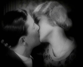 The Actor Ray Milland Kissing a Female British Actor, 1920s. Creator: British Pathe Ltd.