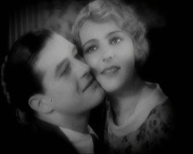 The Actor Ray Milland Embracing a Female British Actor, 1920s. Creator: British Pathe Ltd.