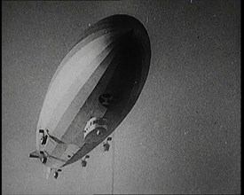 Airship Approaching an Aircraft Carrier And Attempting To Land, 1920s. Creator: British Pathe Ltd.