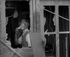 A Man Shaving in a Bombed Out House, 1940. Creator: British Pathe Ltd.