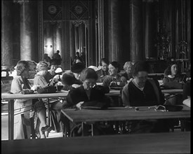 Buckingham Palace Hosting a Sewing Group. Large Numbers of Women Sewing or Knitting, 1940. Creator: British Pathe Ltd.