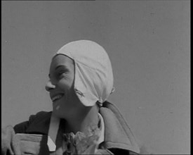 Jean Batten in Flying Gear Smiling to Crowds, 1930s. Creator: British Pathe Ltd.