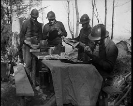 French Soldiers Eating a Meal in a Dug Out, 1940. Creator: British Pathe Ltd.