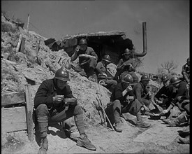 French Soldiers Eating a Meal in a Dug Out, 1940. Creator: British Pathe Ltd.