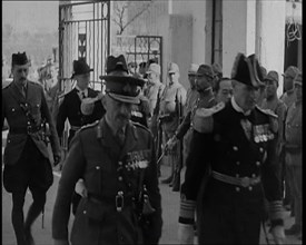 British Military Leaders Walking Through a Gate of Official Building in Shanghai to..., 1937. Creator: British Pathe Ltd.