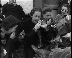 Dutch Refugees Fleeing Aboard Ships in the Netherlands. Women Are Applying Makeup, 1940. Creator: British Pathe Ltd.