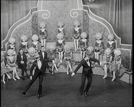 Male and Female Actors in Costumes Performing a Dance Routine On Stage, 1920s. Creator: British Pathe Ltd.