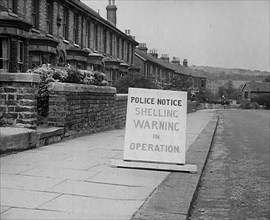 A Police Warning Notice of German Shelling, 1940. Creator: British Pathe Ltd.