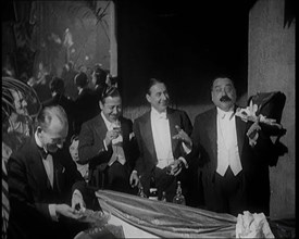 Four Male Civilians Standing Together. They Smile For the Camera, 1924. Creator: British Pathe Ltd.