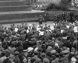 Crowds Listening to a Brass Band in Trafalgar Square, 1940. Creator: British Pathe Ltd.