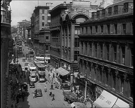 People and Traffic Moving Along Crowded Streets, 1940. Creator: British Pathe Ltd.