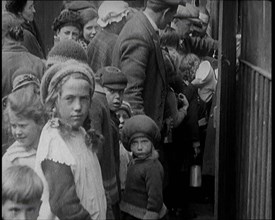 Group of Children Walking Out of a Food Kitchen With Bread And Soup, 1924. Creator: British Pathe Ltd.