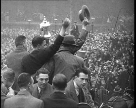 Everton Players Waving to Crowds With the FA Cup, 1930s. Creator: British Pathe Ltd.